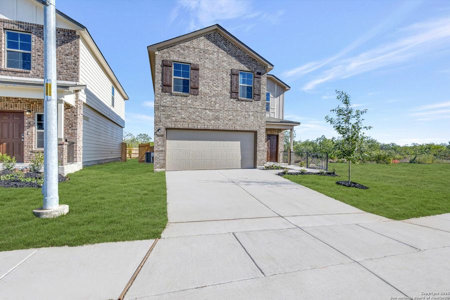 Front exterior of a new home in Paloma Park, Converse, TX, highlighting curb appeal (Image 15).