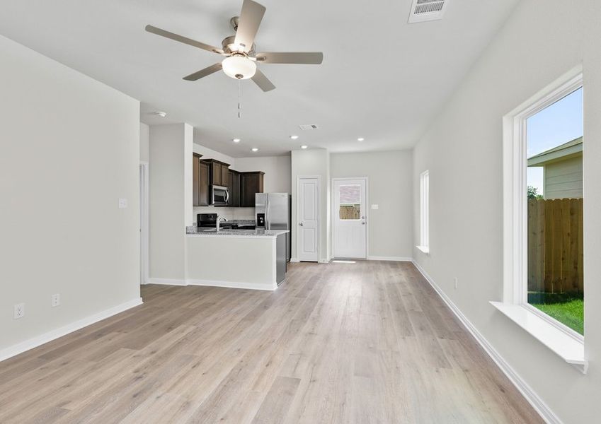 The open living spaces have large windows that let in great, natural light.