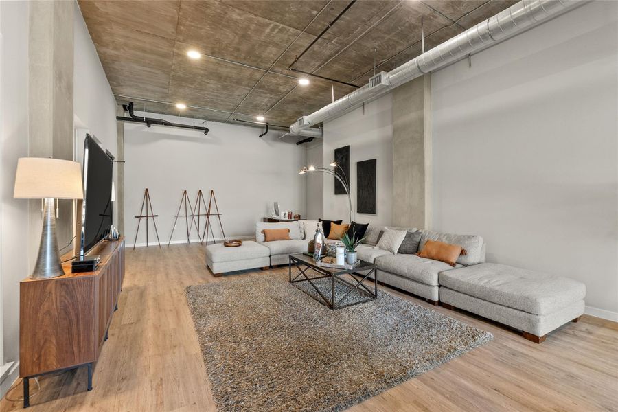 Living room featuring wood finished floors and a barn door