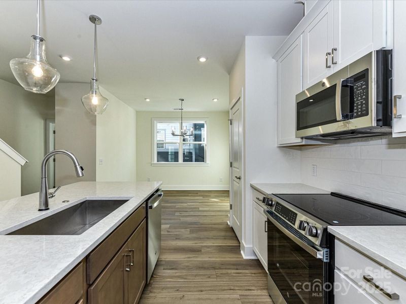 Touch Faucet and Single Basin Sink at Central Island.