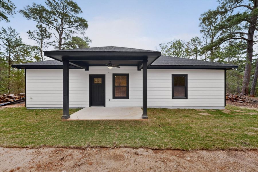 Contemporary exterior featuring white horizontal siding and a dark shingled roof Contemporary exterior featuring white horizontal siding and a dark shingled roof