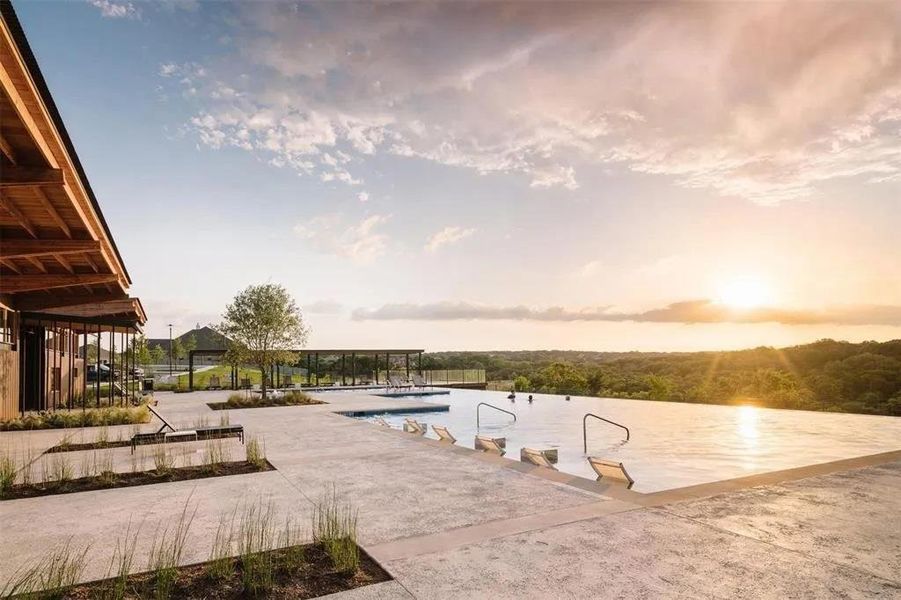 Community pool with a patio