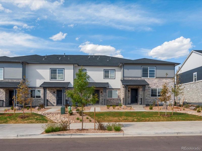 Front exterior of a new home in Skyview at High Point, Aurora, CO, highlighting curb appeal (Image 19).