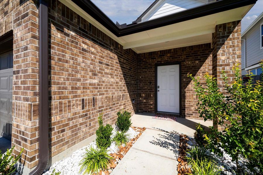 Front exterior of a new home in Granger Pines, Conroe, TX, highlighting curb appeal (Image 13). Front exterior of a new home in Granger Pines, Conroe, TX, highlighting curb appeal (Image 13).
