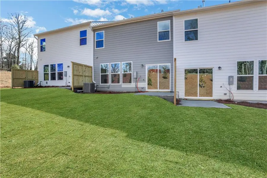Exterior details and patio area of a home in Villas at Dawsonville Townhomes, Dawsonville (Image 18).