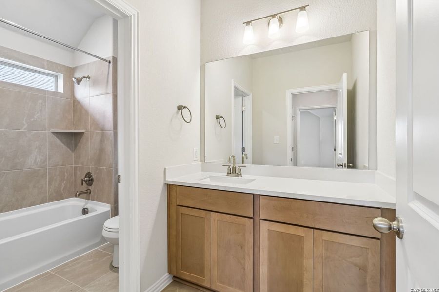 Furnished interior view inside a new home in Stream Waters, Seguin (Image 9).