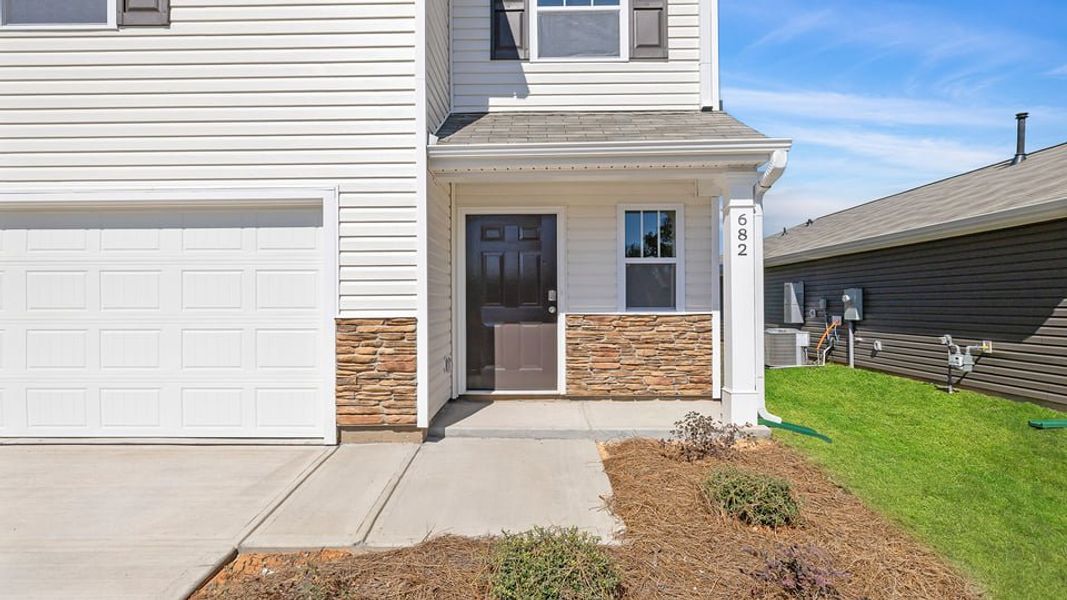 Exterior details and patio area of a home in Village Grove, Greenville (Image 2). Exterior details and patio area of a home in Village Grove, Greenville (Image 2).