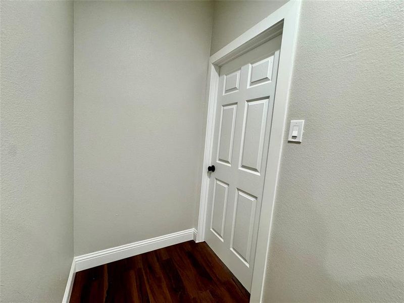 Hallway featuring hardwood / wood-style floors