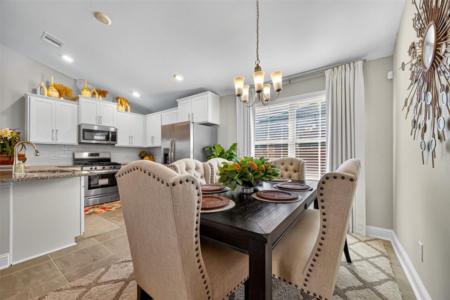 Furnished interior view inside a new home in Sunterra, Katy (Image 23).