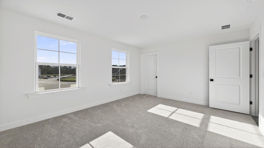 Spacious, unfurnished interior of a new home in Creekside at Andrews, Summerville (Image 22).
