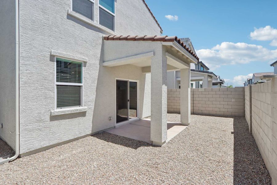 A white building with a door.