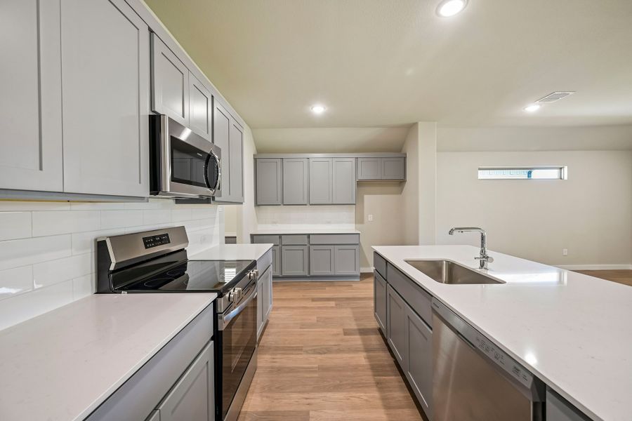 Kitchen in the Harrison home plan by Trophy Signature Homes