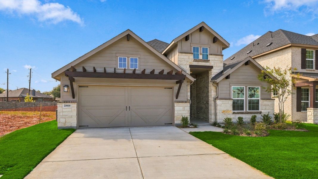 Front exterior of a new home in Taylor Estates, Corinth, TX, highlighting curb appeal (Image 21). Front exterior of a new home in Taylor Estates, Corinth, TX, highlighting curb appeal (Image 21).