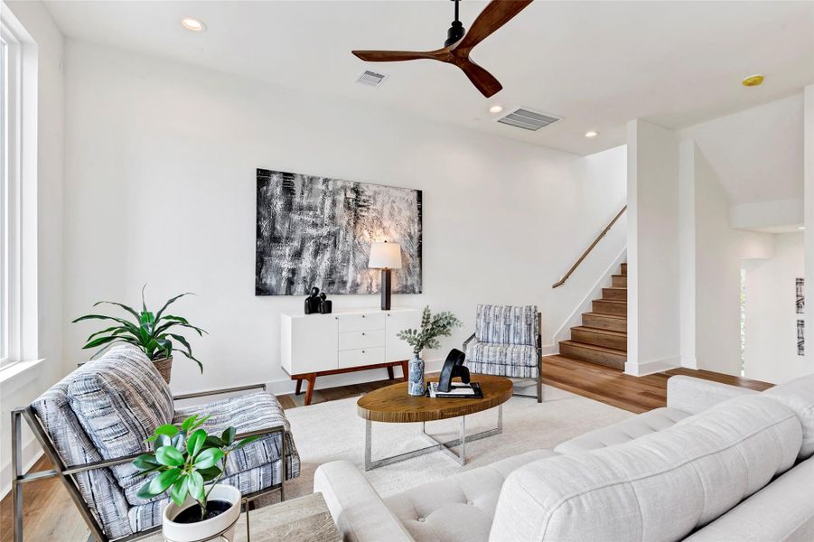 Another view of the inviting living room, with a peek at the staircase leading up to the third floor. Another view of the inviting living room, with a peek at the staircase leading up to the third floor.
