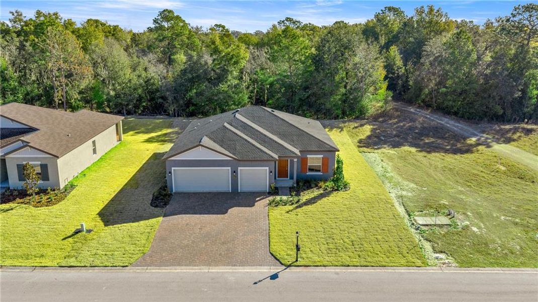 Front exterior of a new home in Juliette Falls, Dunnellon, FL, highlighting curb appeal (Image 4). Front exterior of a new home in Juliette Falls, Dunnellon, FL, highlighting curb appeal (Image 4).