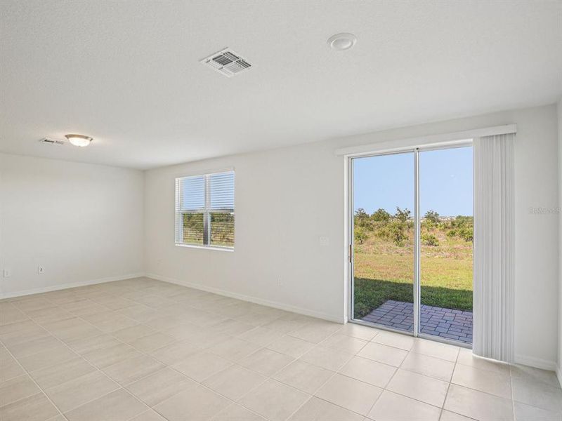 Spacious, unfurnished interior of a new home in The Reserve at Hammock Oaks - Signature Series, Lady Lake (Image 6).