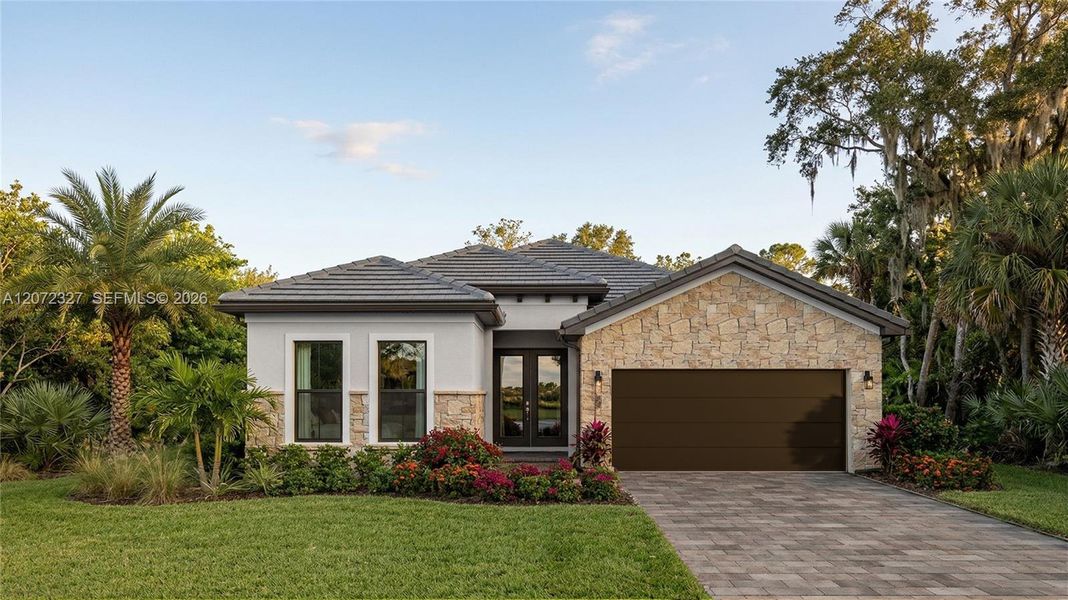 Front exterior of a new home in , Homestead, FL, highlighting curb appeal (Image 1). Front exterior of a new home in , Homestead, FL, highlighting curb appeal (Image 1).