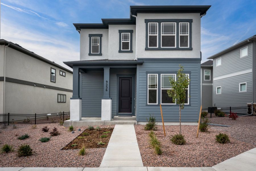 Front exterior of a new home in Revel Crossing at Wolf Ranch – The Outlook Collection, Colorado Springs, CO, highlighting curb appeal (Image 27). Front exterior of a new home in Revel Crossing at Wolf Ranch – The Outlook Collection, Colorado Springs, CO, highlighting curb appeal (Image 27).