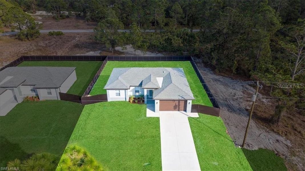 Front exterior of a new home in , Lehigh Acres, FL, highlighting curb appeal (Image 23).