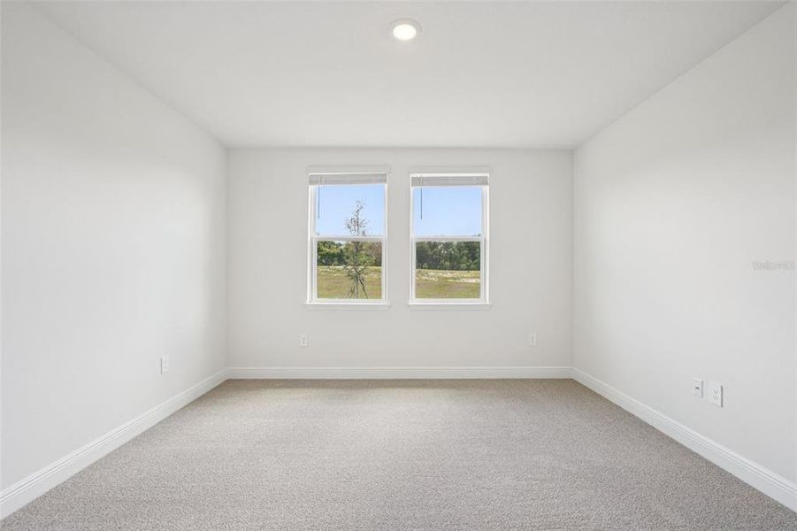 Spacious, unfurnished interior of a new home in The Reserve at Hammock Oaks - Signature Series, Lady Lake (Image 17).