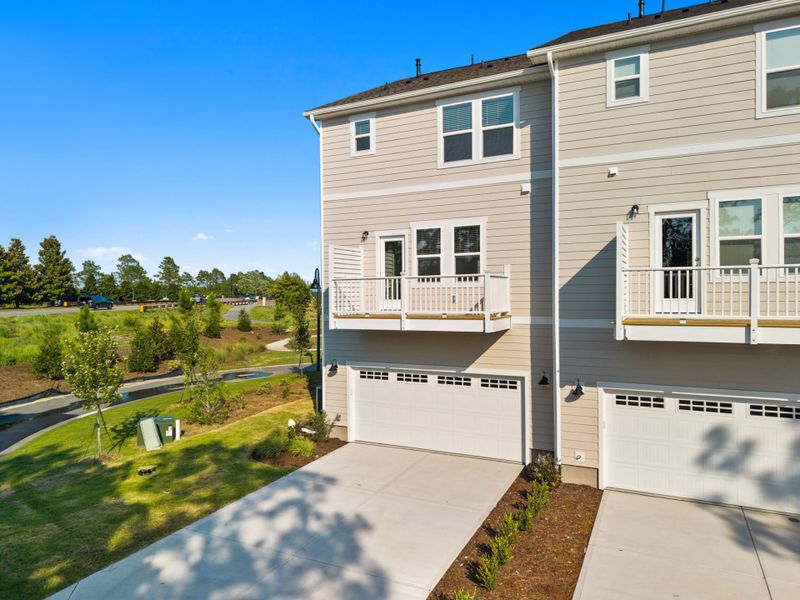 Exterior details and patio area of a home in Lakeside Townes at Riverlights, Wilmington (Image 3). Exterior details and patio area of a home in Lakeside Townes at Riverlights, Wilmington (Image 3).