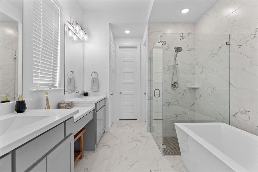 Immaculate & light-filled, the primary bath offers a soaking tub & spacious shower ~ a refreshing space to start or end your day. Immaculate & light-filled, the primary bath offers a soaking tub & spacious shower ~ a refreshing space to start or end your day.