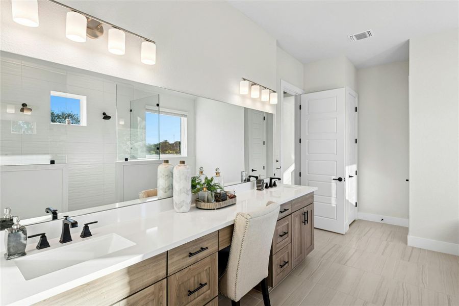 Full bath with a walk in shower and double vanity Full bath with a walk in shower and double vanity