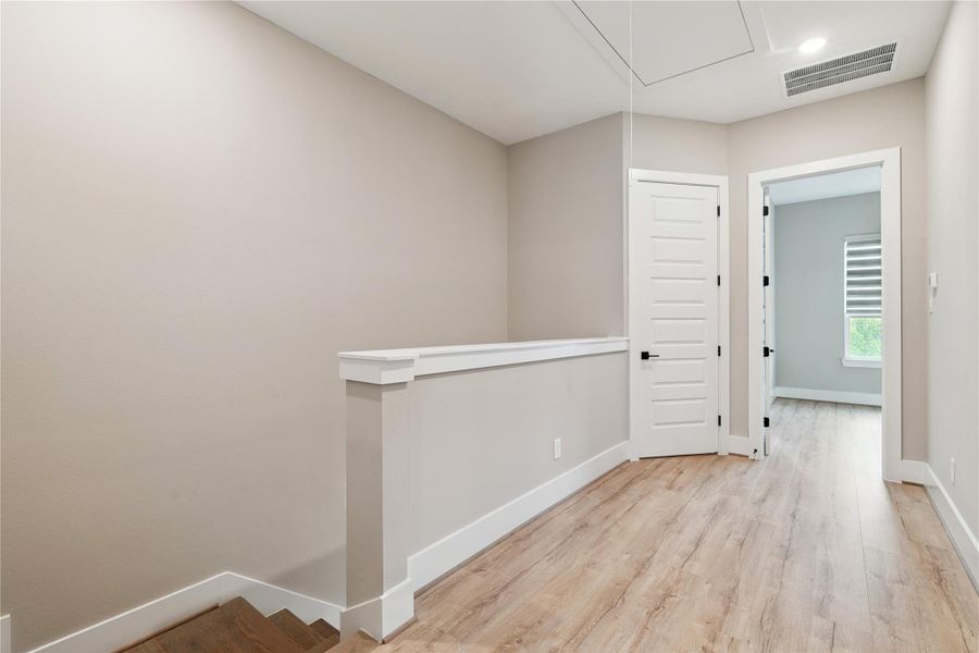 A moment of pause between levels, the stair landing emphasizes spatial clarity and minimal interference.