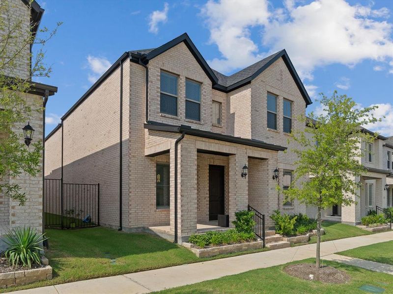 Front exterior of a new home in Village on Main Street, Frisco, TX, highlighting curb appeal (Image 23).