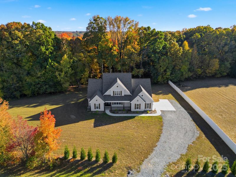 Front exterior of a new home in , Monroe, NC, highlighting curb appeal (Image 26).