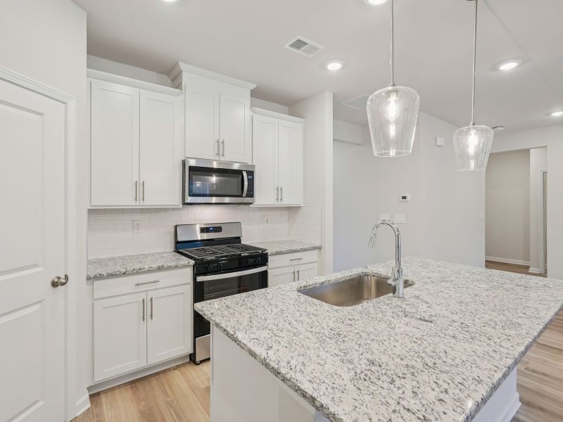 Furnished interior view inside a new home in Vines at Mill Creek - Estate Series, Braselton (Image 7).