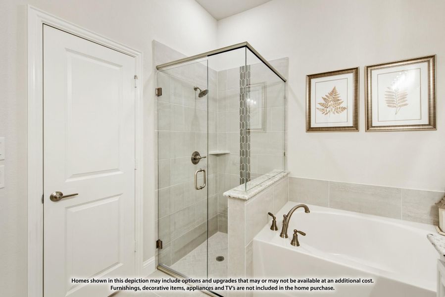 Bathroom with glass-enclosed tile shower, soaking tub, and neutral tile walls Bathroom with glass-enclosed tile shower, soaking tub, and neutral tile walls