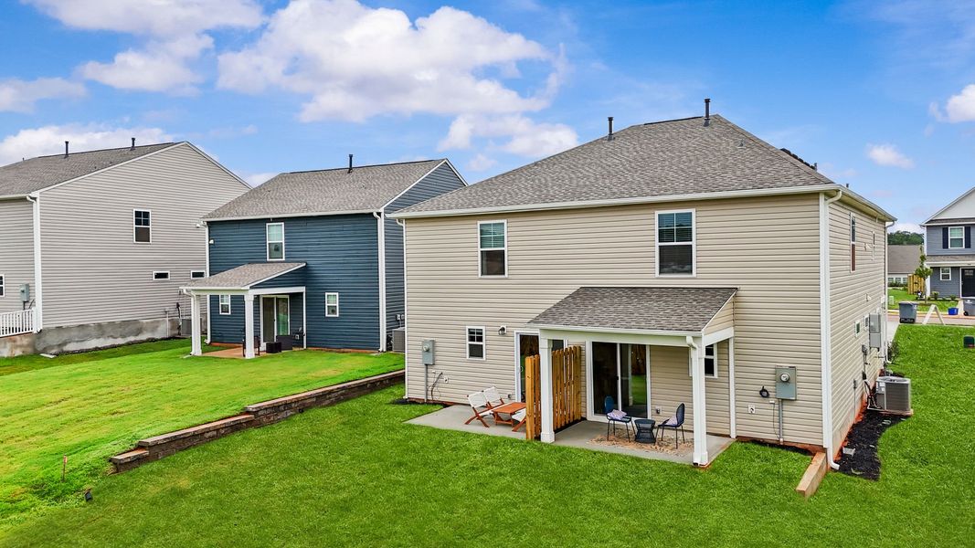 Exterior details and patio area of a home in Champions Village at Cherry Hill, Pendleton (Image 33).