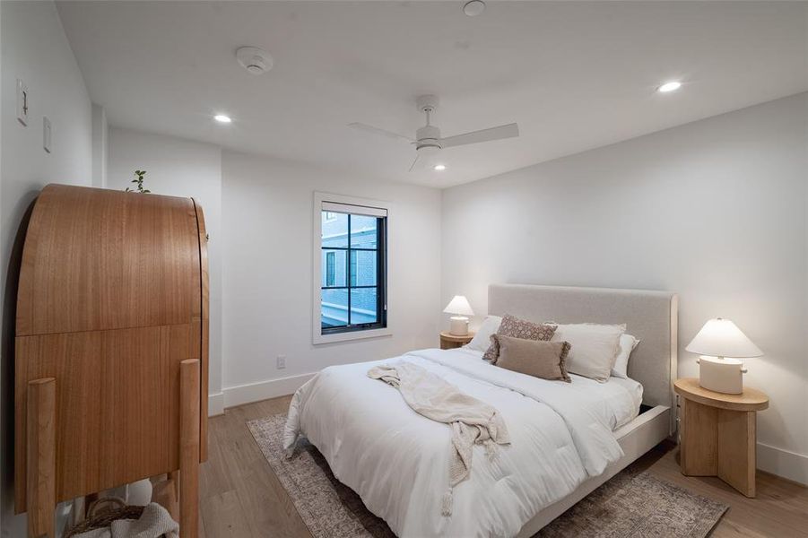 Bedroom featuring light hardwood floors and ceiling fan