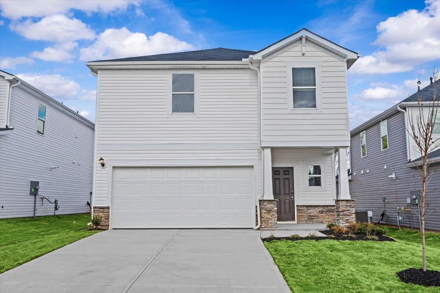 Front exterior of a new home in Creek Ridge - Heritage Collection, Spartanburg, SC, highlighting curb appeal (Image 1).