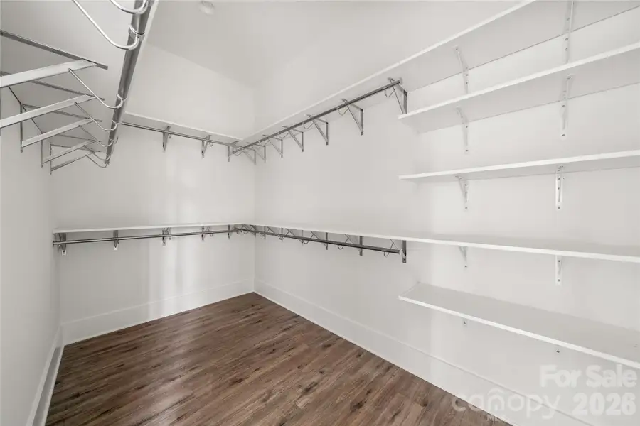 Main floor primary suite walk-in closet Main floor primary suite walk-in closet