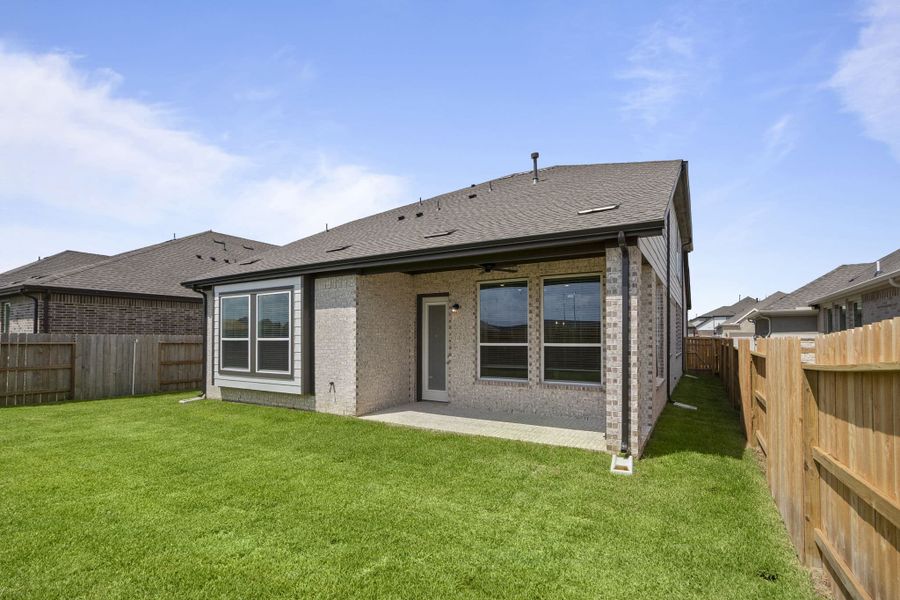 Front exterior of a new home in Wood Leaf Reserve, Tomball, TX, highlighting curb appeal (Image 22).