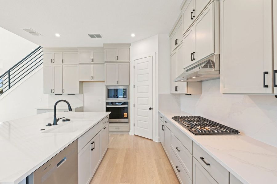 Furnished interior view inside a new home in Persimmon, Buda (Image 6).