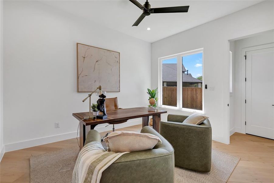 Office area with a ceiling fan, light wood finished floors, and recessed lighting Office area with a ceiling fan, light wood finished floors, and recessed lighting