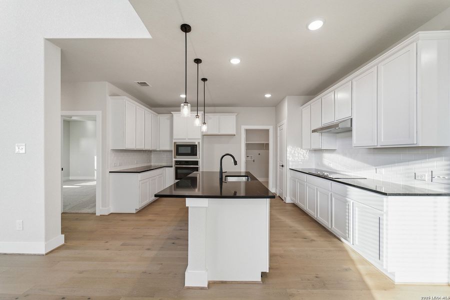 Furnished interior view inside a new home in The Woodlands at Medina Hills, Mico (Image 13).