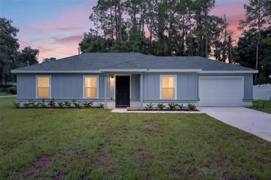 Front exterior of a new home in , Ocala, FL, highlighting curb appeal (Image 2). Front exterior of a new home in , Ocala, FL, highlighting curb appeal (Image 2).