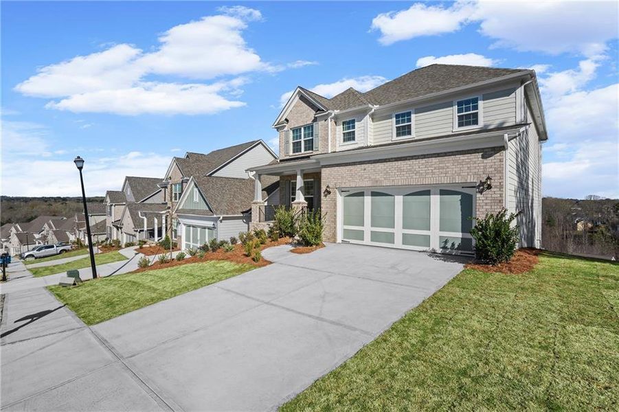 Front exterior of a new home in Sierra Creek, Hoschton, GA, highlighting curb appeal (Image 31).