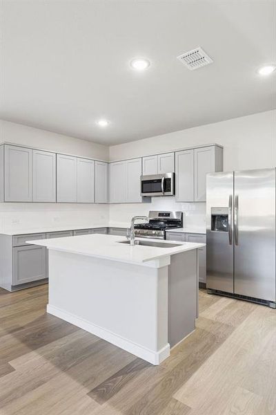 Kitchen in the Haylee home plan by Trophy Signature Homes - REPRESENTATIVE PHOTO Kitchen in the Haylee home plan by Trophy Signature Homes - REPRESENTATIVE PHOTO