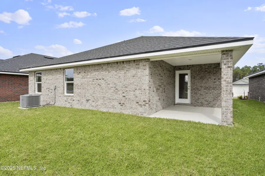 Exterior details and patio area of a home in Shadow Crest at Rolling Hills, Green Cove Springs (Image 2).