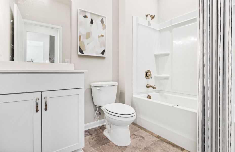 Secondary Bathroom with a soaking tub.