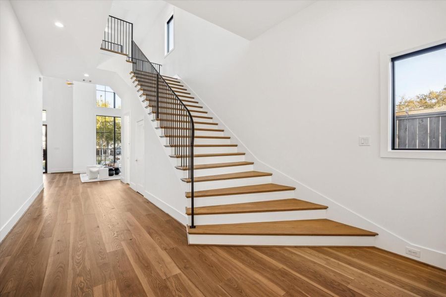 Curved staircase serves as a sculptural focal point, guiding movement through the home while preserving open sightlines and natural light. Wide plank floors and clean transitions reinforce a layout designed for both flow and everyday ease. **Previous build by Arch Angelo** Curved staircase serves as a sculptural focal point, guiding movement through the home while preserving open sightlines and natural light. Wide plank floors and clean transitions reinforce a layout designed for both flow and everyday ease. **Previous build by Arch Angelo**