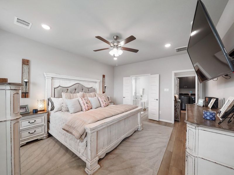 A seamless connection to the ensuite enhances the functionality of the primary suite while maintaining a private retreat feel.