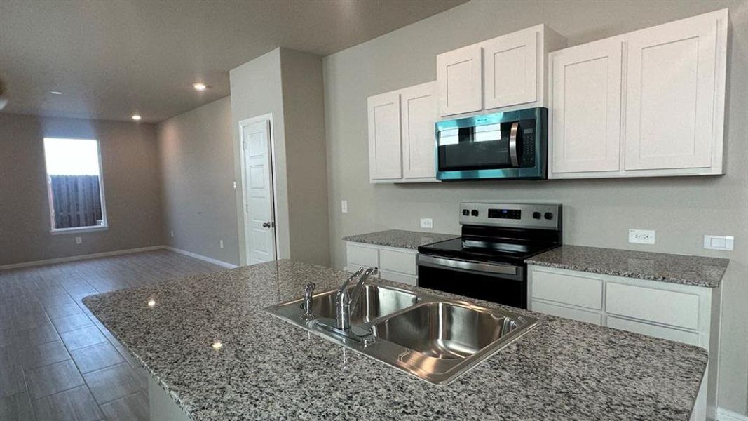 Kitchen - All Home and community information, including pricing, included features, terms, availability and amenities, are subject to change at any time without notice or obligation. All Drawings, pictures, photographs, video, square footages, floor plans, elevations, features, colors and sizes are approximate for illustration purposes only and will vary from the homes as built. Kitchen - All Home and community information, including pricing, included features, terms, availability and amenities, are subject to change at any time without notice or obligation. All Drawings, pictures, photographs, video, square footages, floor plans, elevations, features, colors and sizes are approximate for illustration purposes only and will vary from the homes as built.