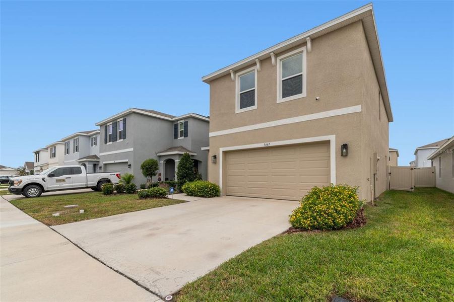 Front exterior of a new home in Westgate at Avalon Park, Wesley Chapel, FL, highlighting curb appeal (Image 26).