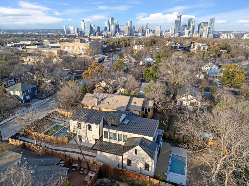 Aerial view of residential area featuring skyline